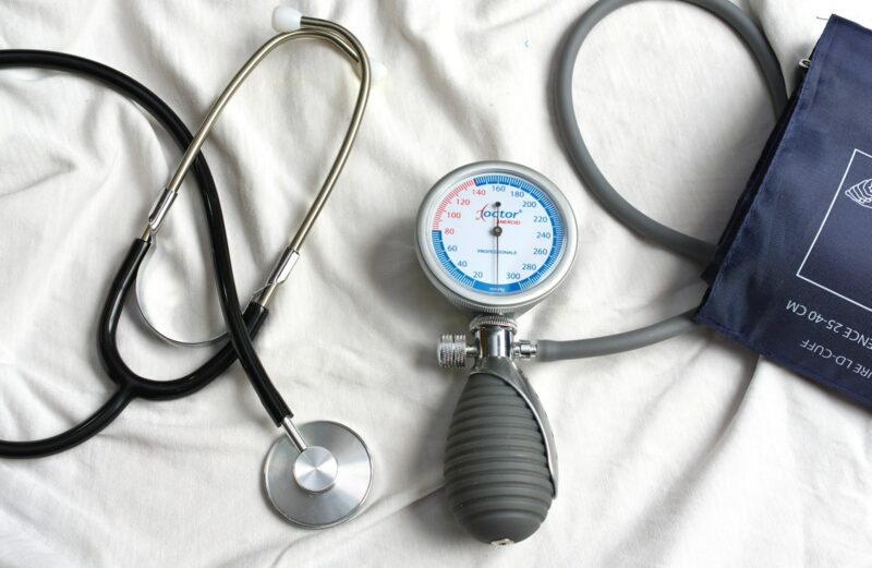 The “Hamam Trap”: 3 Health Risks of the Kashmiri Winter Lifestyle a stethoscope laying on top of a bed next to a medical bag